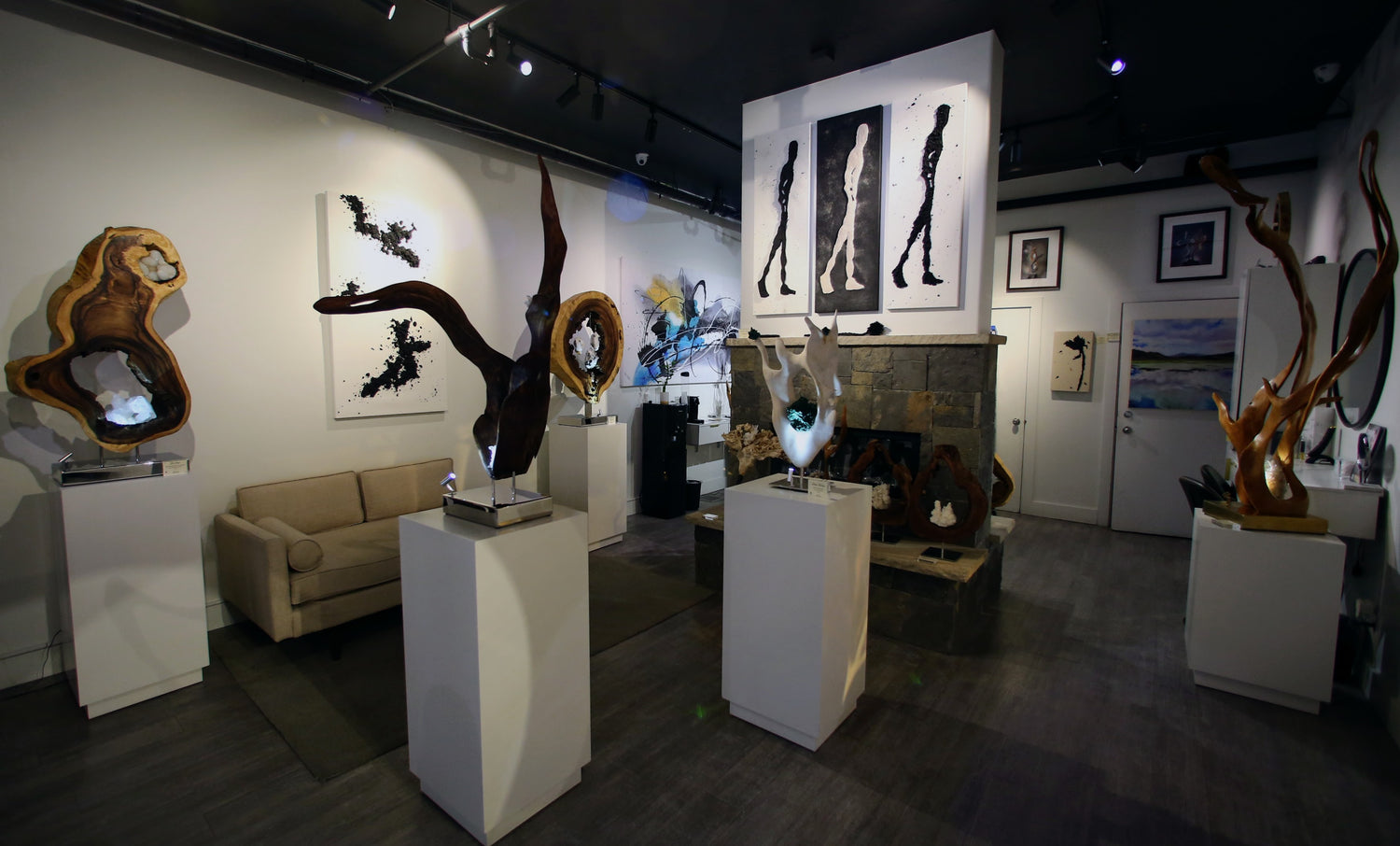 Inside of gallery with sculpture and paintings