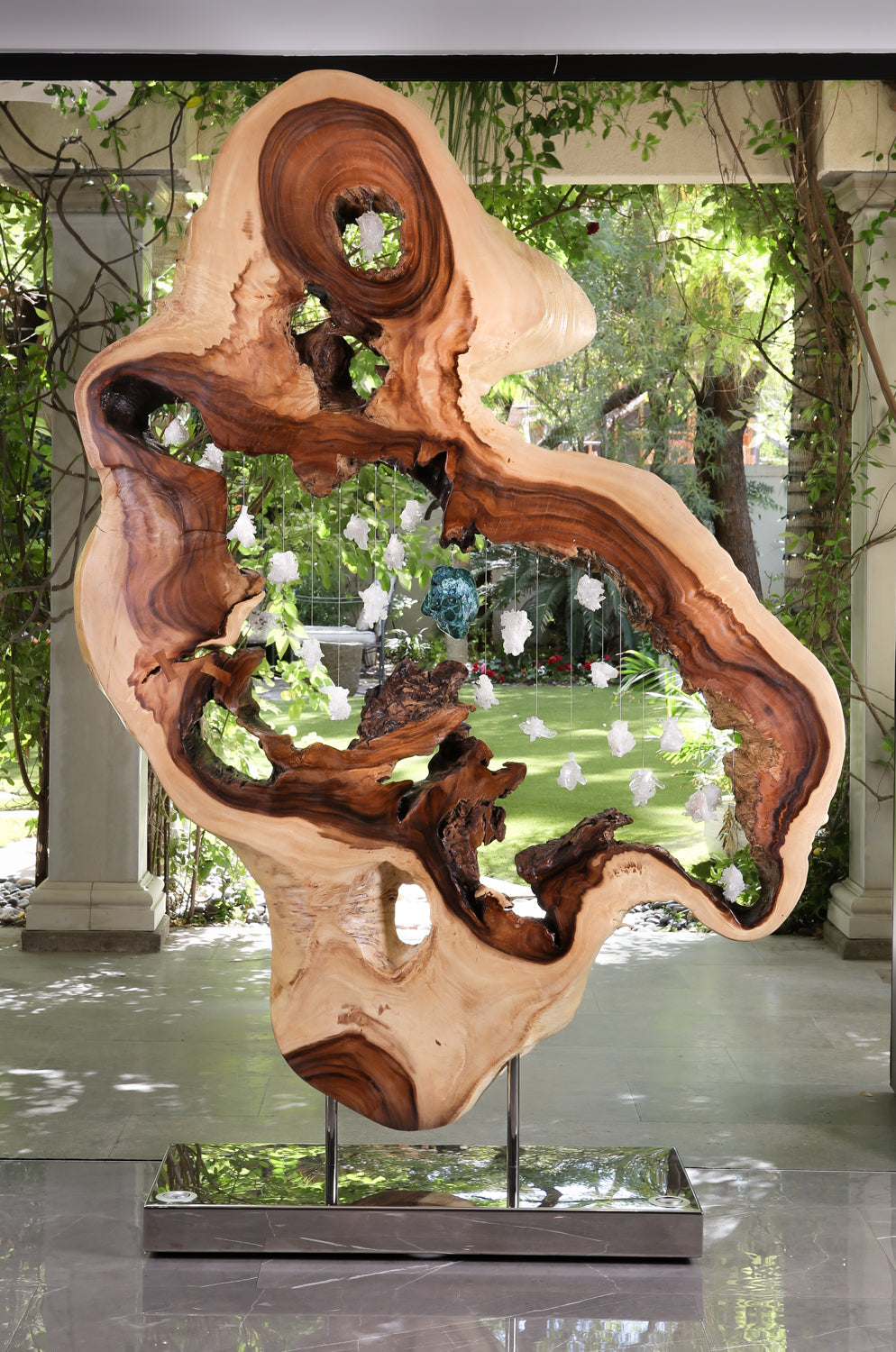 Constellations by Dorit Schwartz, a large sculpture of acacia wood, white quartz crystal and malachite