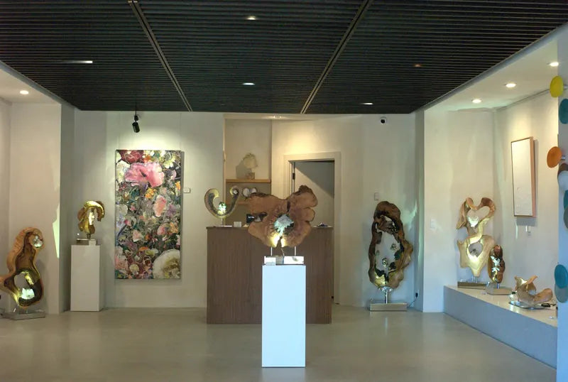 Inside GAIA Sun Valley on Sun Valley Road in Ketchum: wood and crystal sculptures and a large floral painting